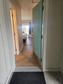 Whe we saw repairs being done to first room..next two photos were patched and buckled floors in the bathroom.