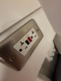 Electrical outlet right behind the shower