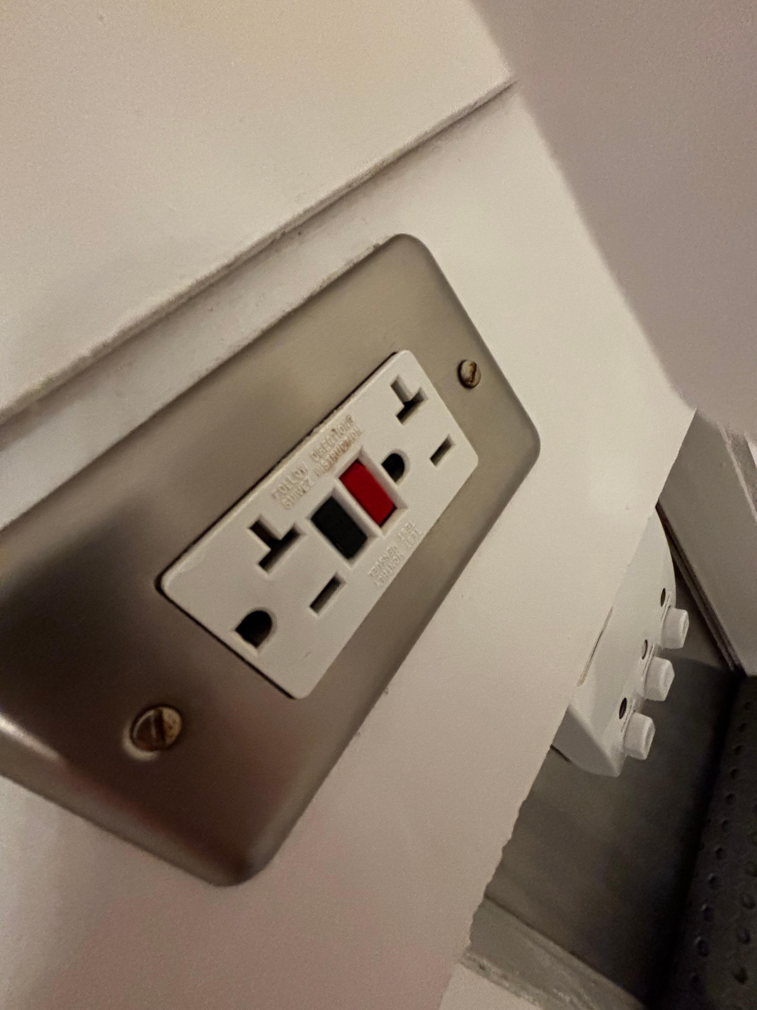 Electrical outlet right behind the shower