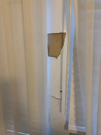 Chips in wall next to bef