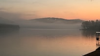 Beautiful sunrise glow and fog over the lake. Morning coffee never tasted so good!