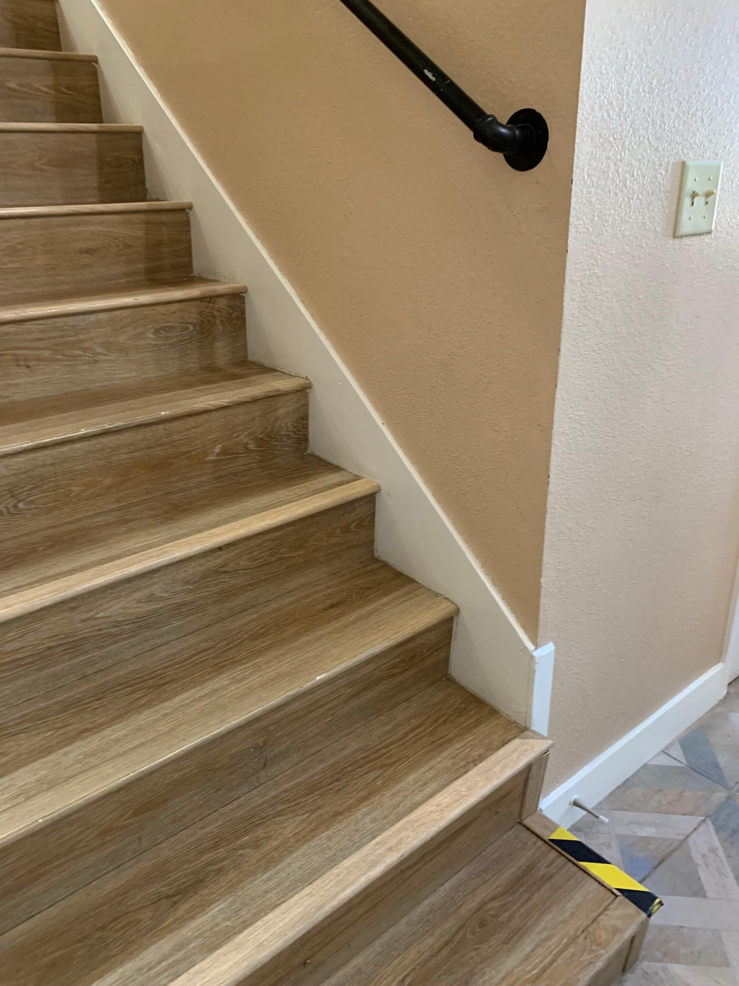 Handrail at the bottom of the stairs falls short by 3 stairs. 