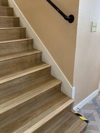 Handrail at the bottom of the stairs falls short by 3 stairs.