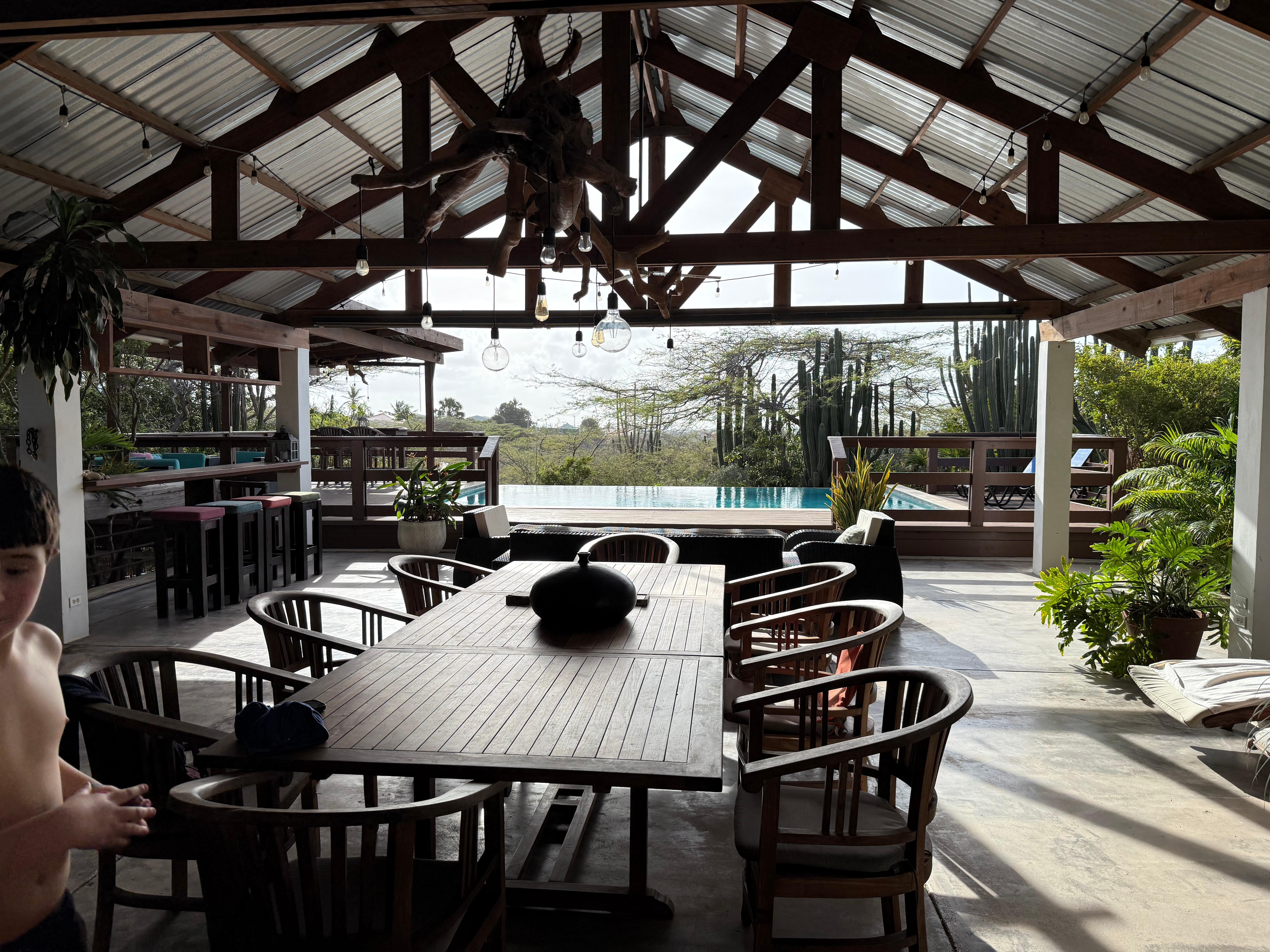 View from the pool at night back at the living space 