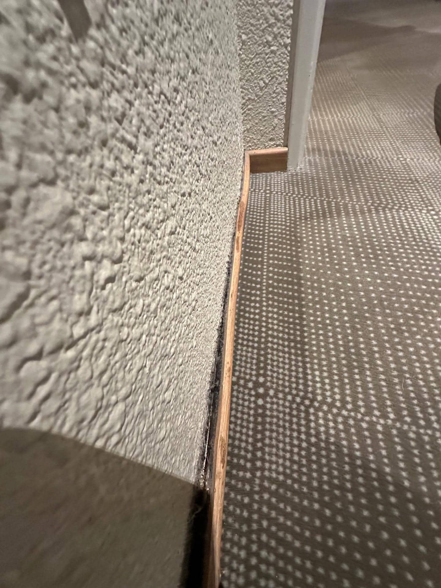 Skirting board hanging off. 