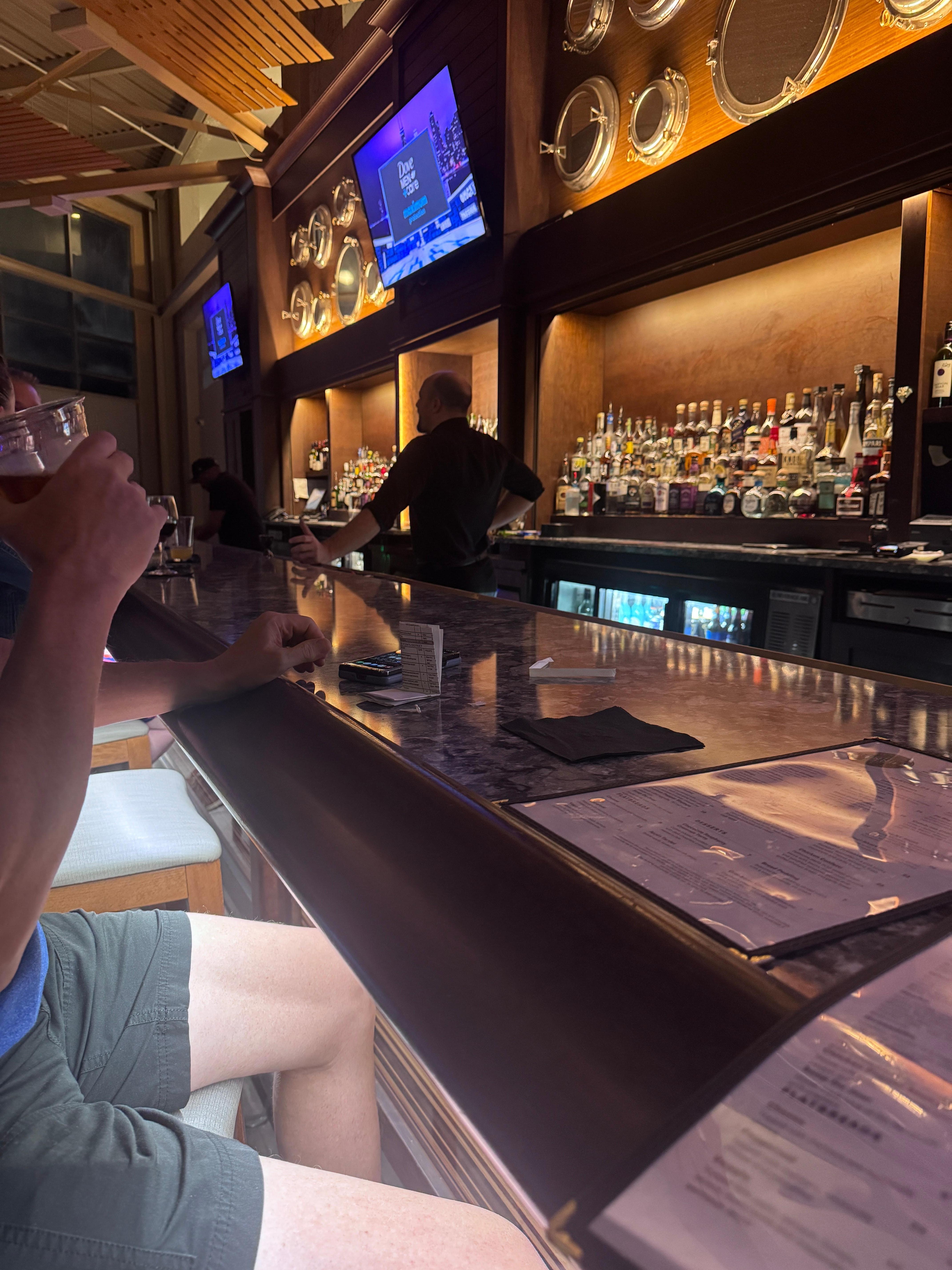 Our bartender ignoring us.