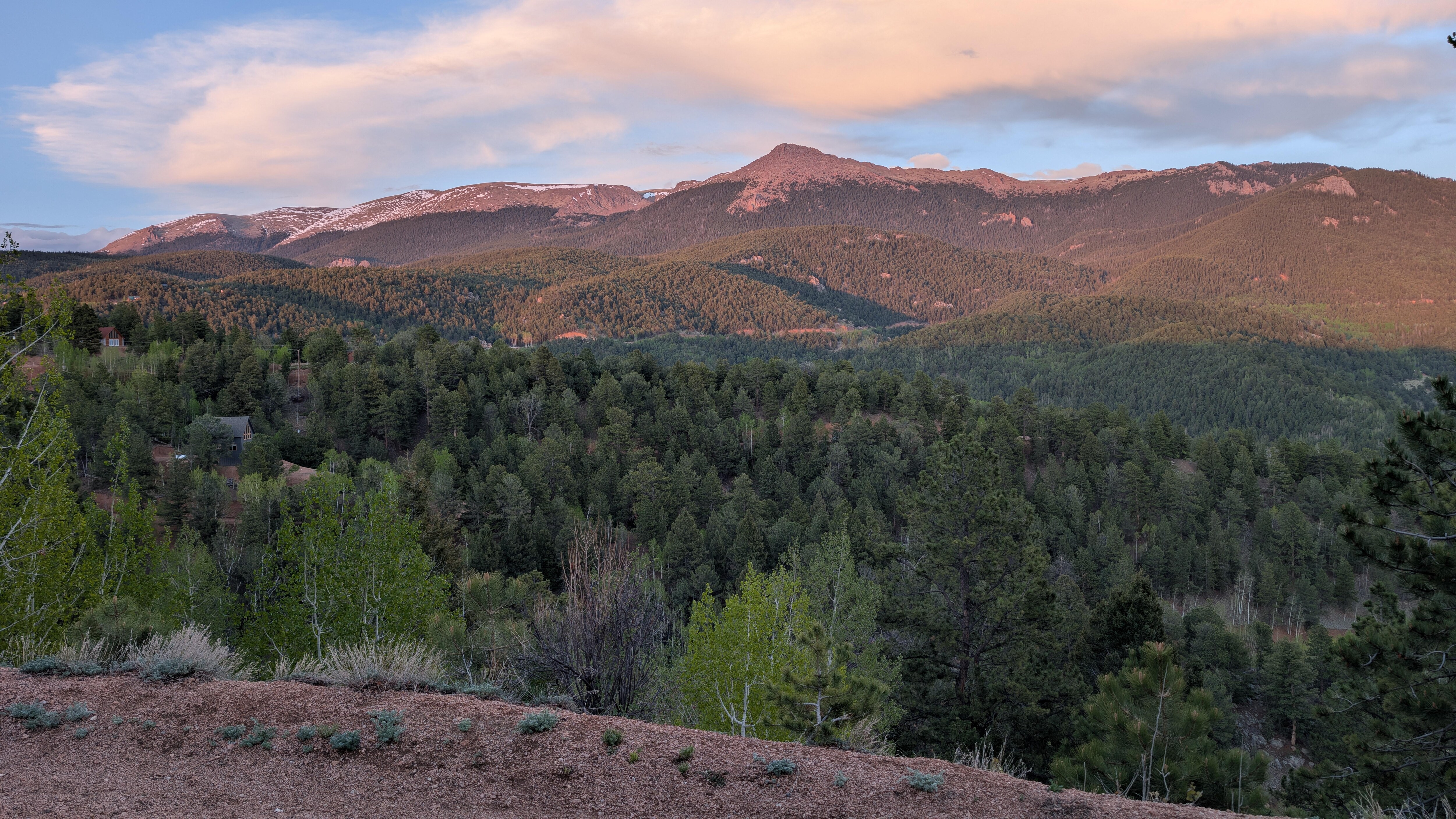 A lovely sunset coloring Pikes Peak pink, from the front porch.