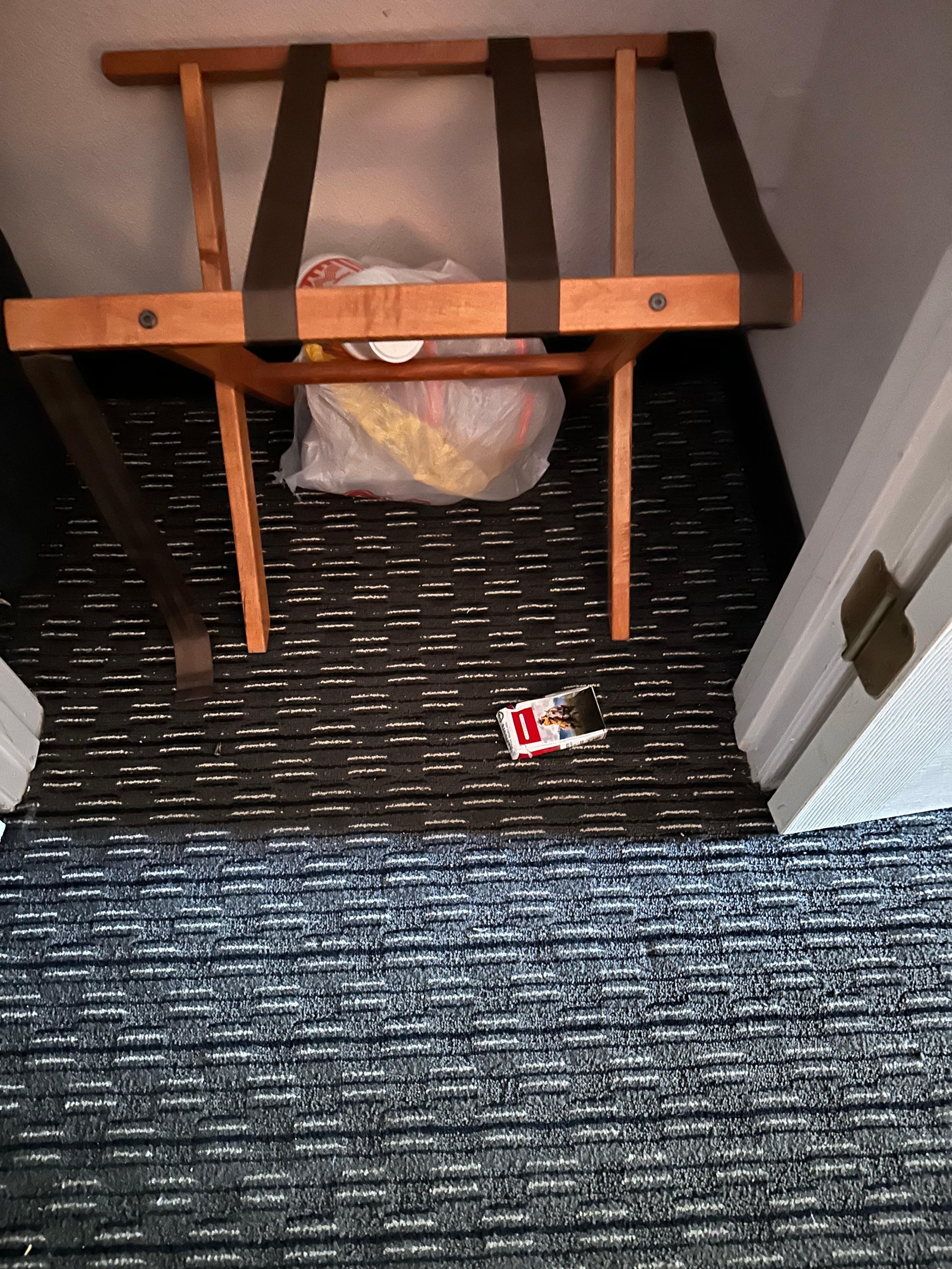 First room with strong cigarette odor and trash in closet.