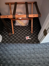 First room with strong cigarette odor and trash in closet.