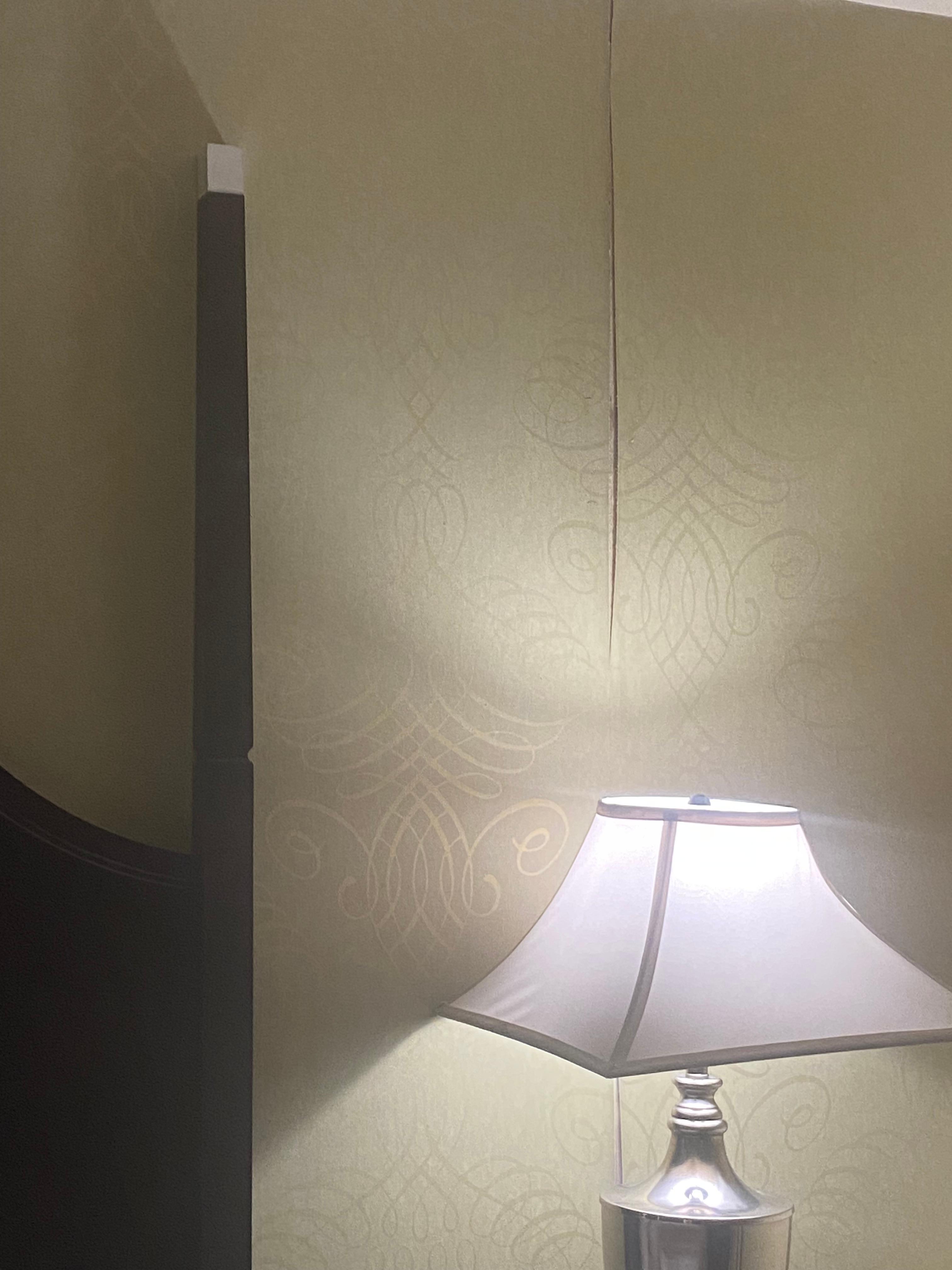 Wallpaper peeling from wall