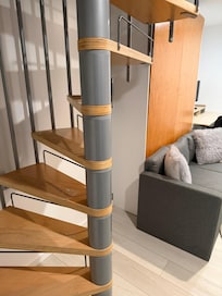 Utility room with a Murphy bed behind the couch.