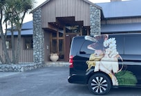 Entrance and their courtesy van.