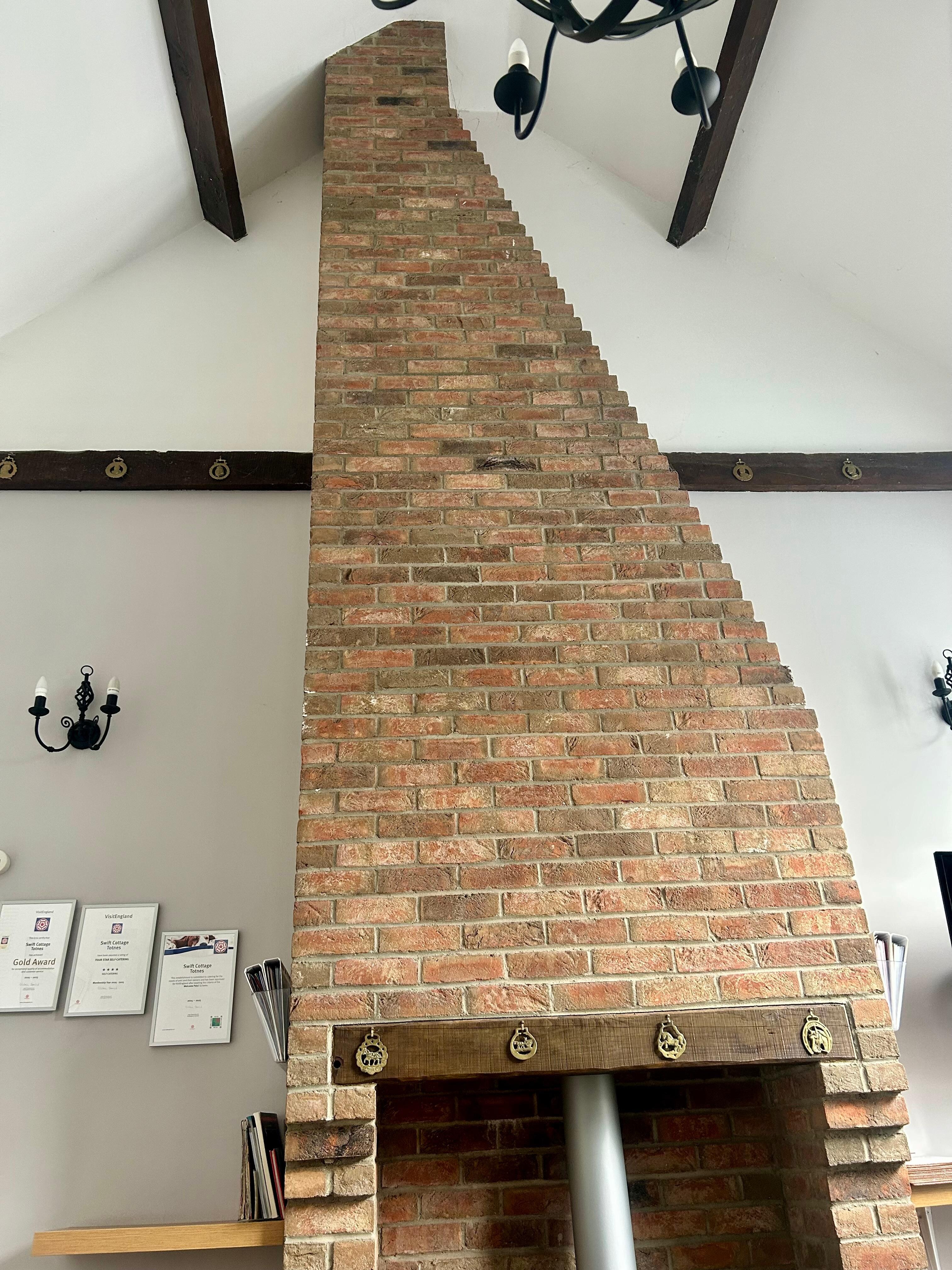 Wonderful brick chimney breast with log burner 