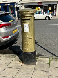 Olympic gold medalist post box on main shopping street.
