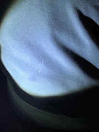 Hair on pillowcase, difficult to see on image