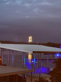 Fireworks at night watched from deck off the house