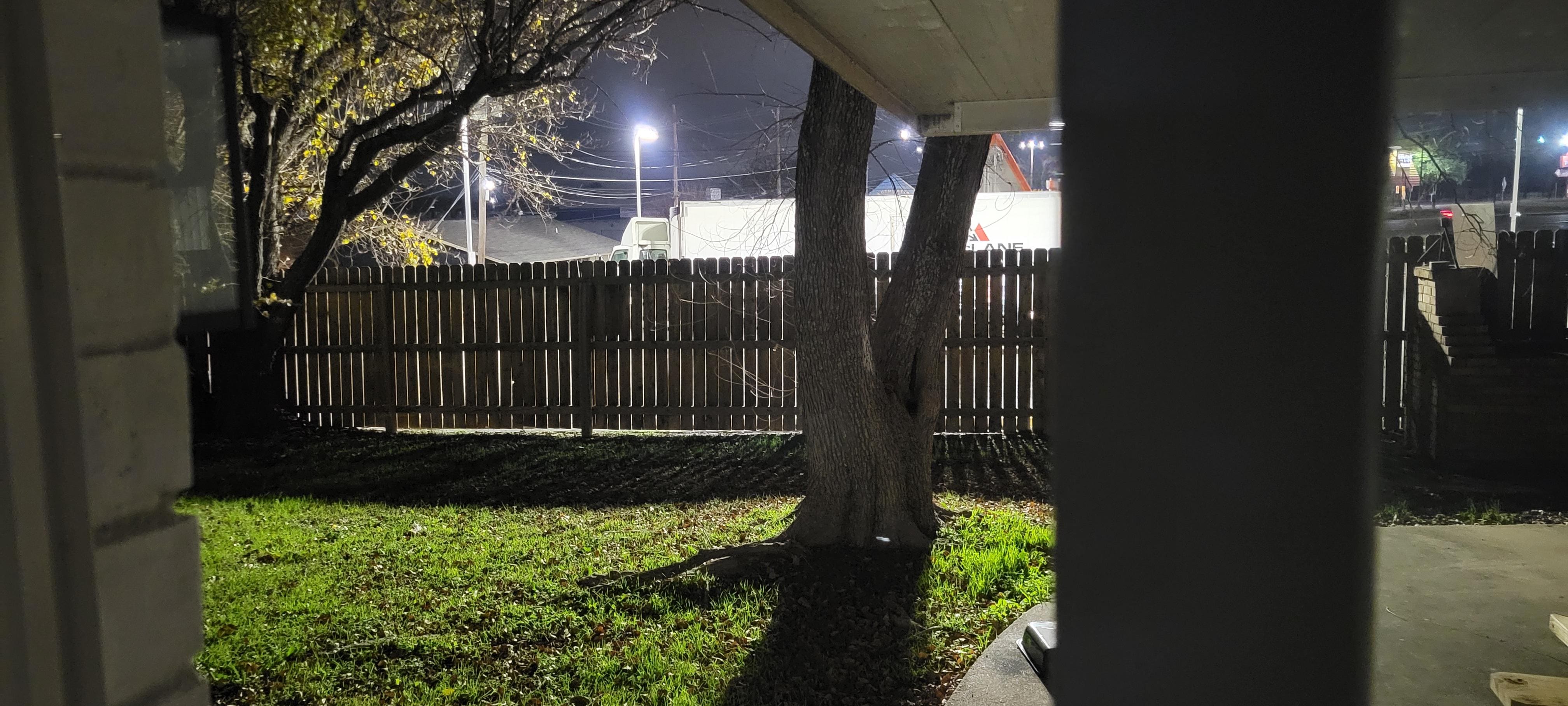 Picture of the backyard at 6:00 a.m. illuminated by the open 24 hour Whattaburger "right there".