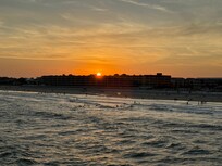 The sunset - looking back at the beach while out on the pier