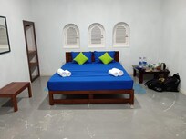 Double bed in larger bedroom suitable for 3 guests