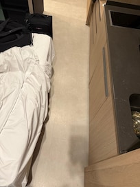 Space between kitchen and bed