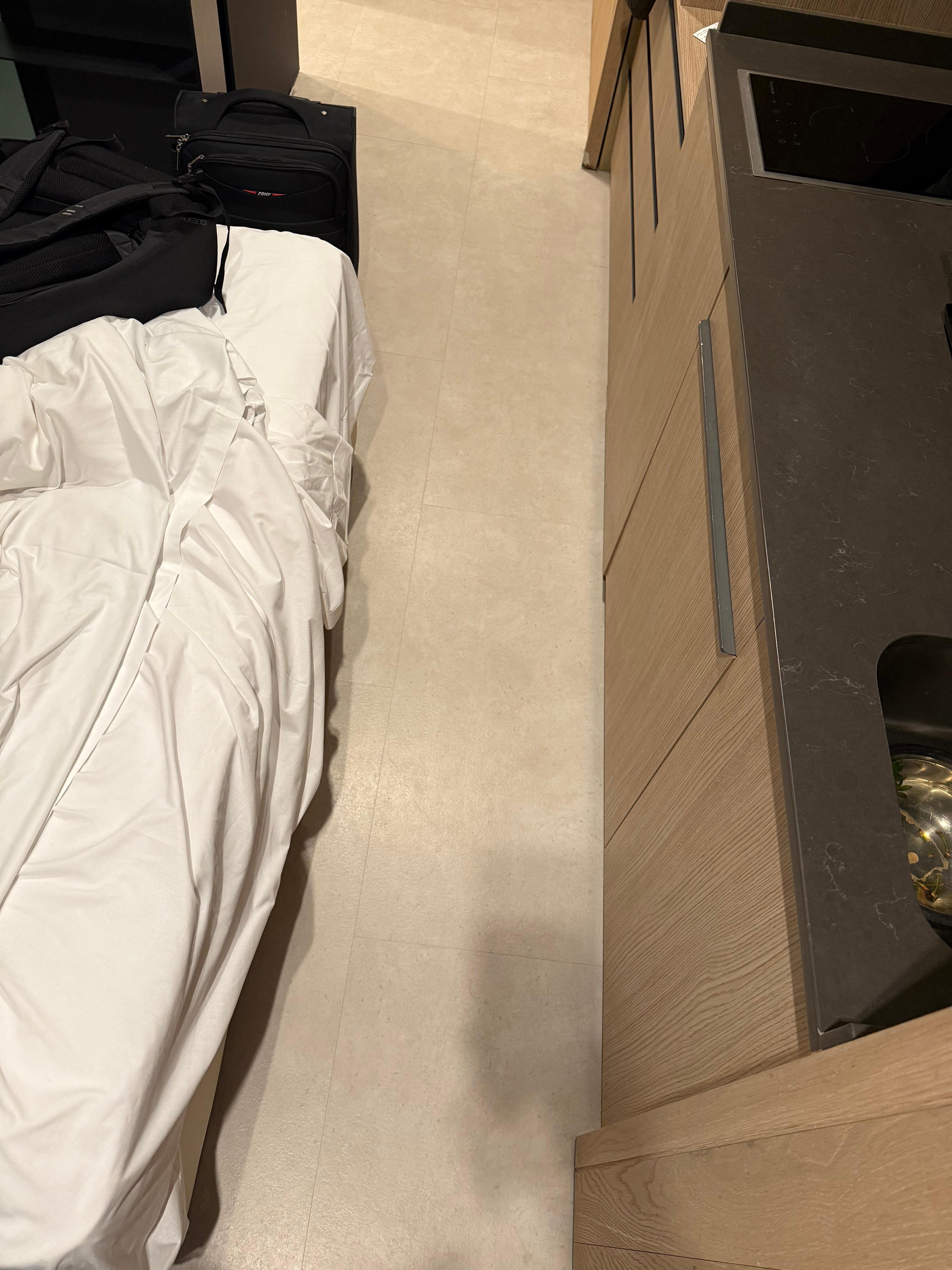 Space between kitchen and bed