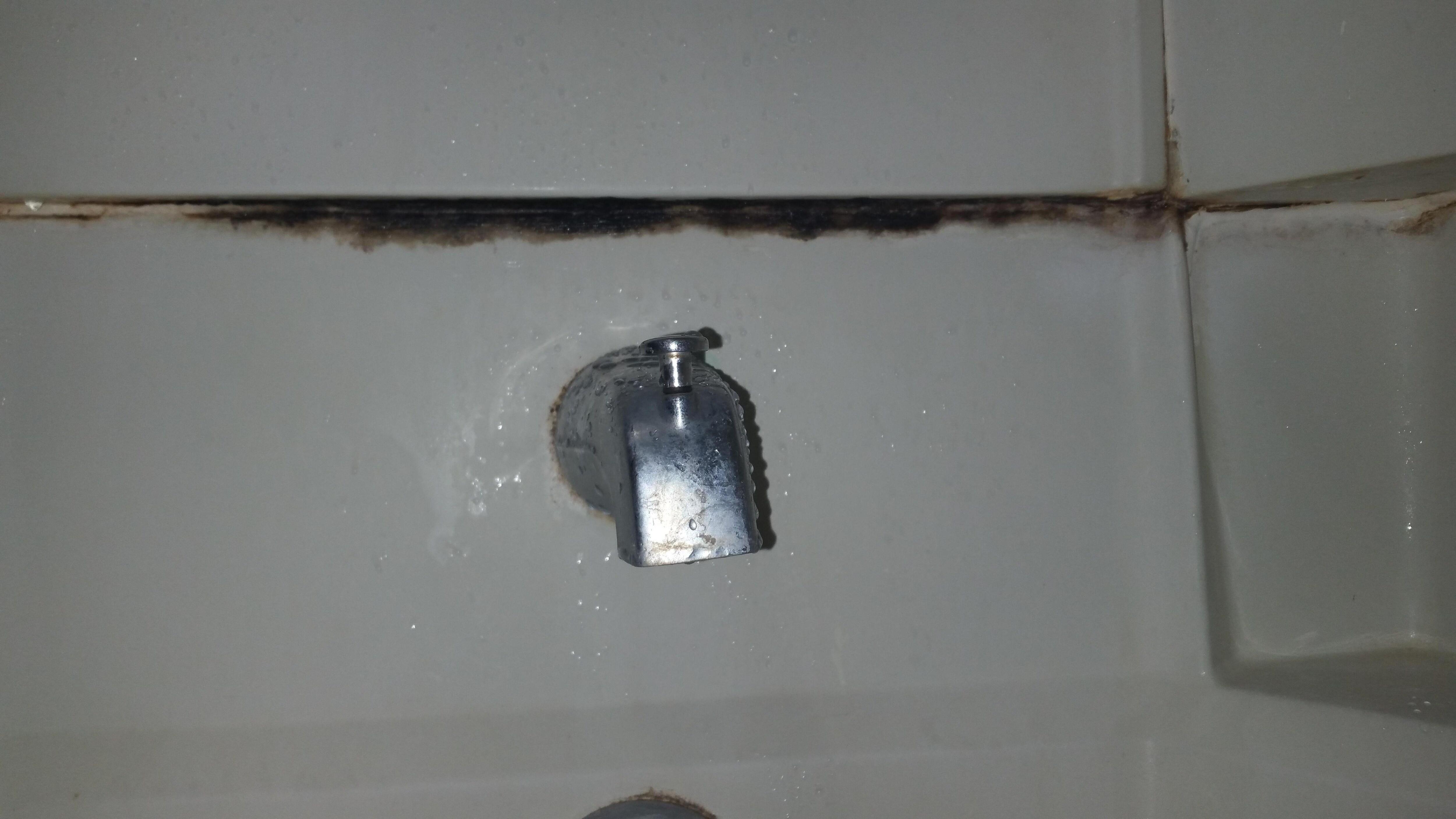 The tile had just been propped up against the wall and fell over when I put something in the wastebasket.