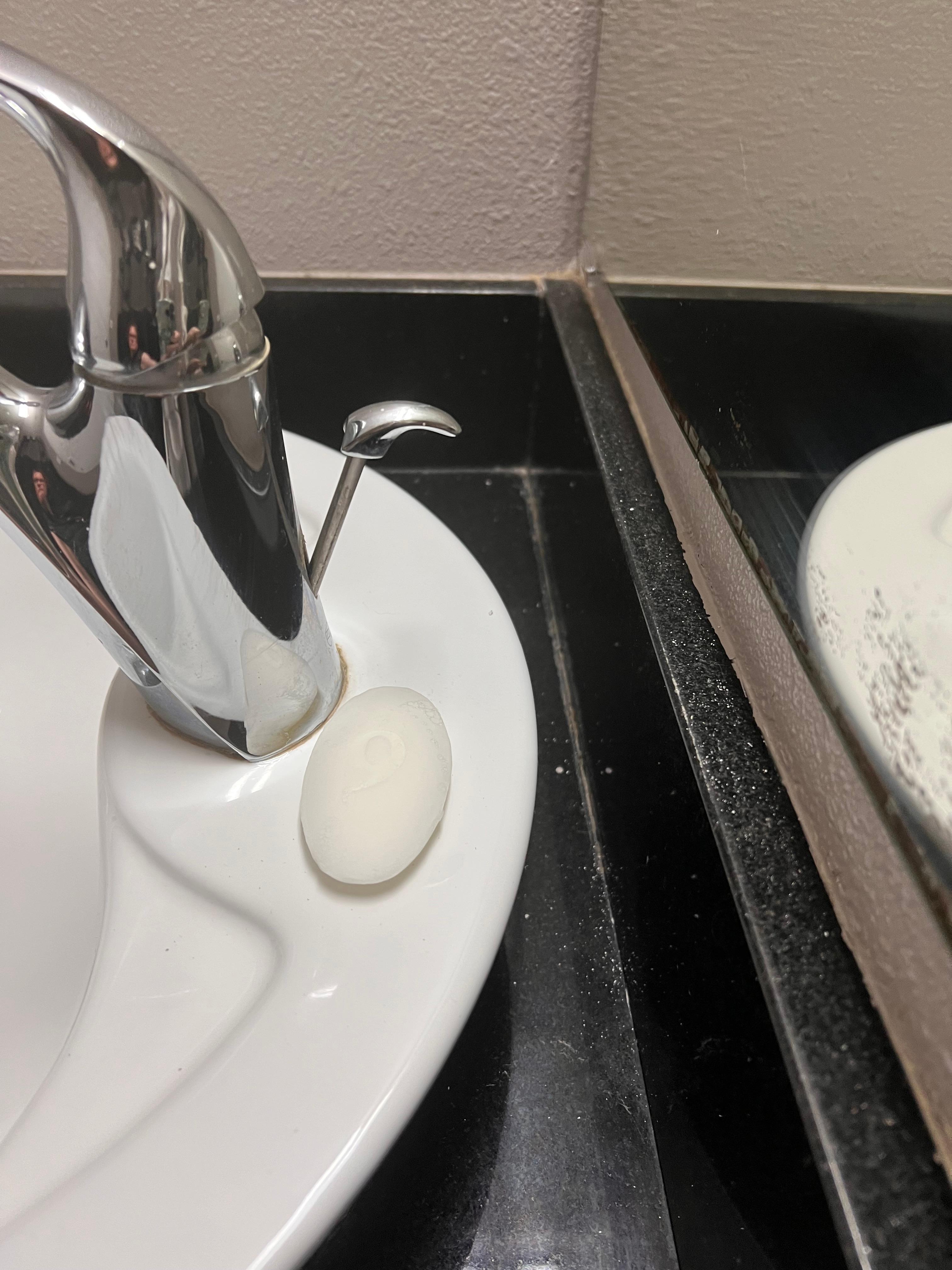 Some sort of white dust on the back of the sink area…??