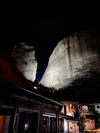 Alsos House at night in the backdrop of a lit up  hill