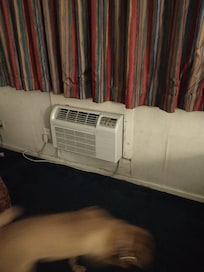 Musty smelling room and obvious water damage around the unit.