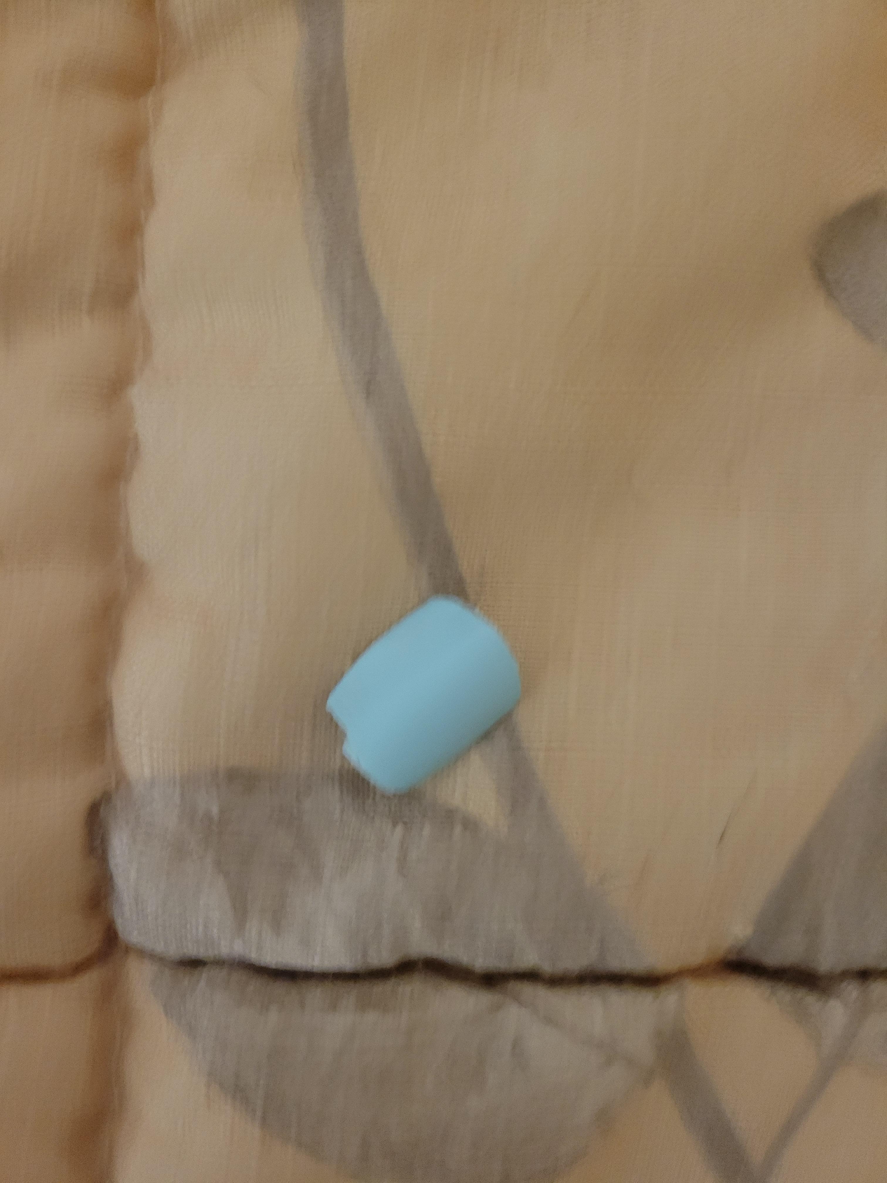 Fake fingernail found between bed and wall where a vacuum cleary would fit.