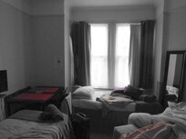 Crammed Room, also notice damage to wall next to mirror