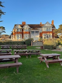 Rear of hotel with lots of seating area
