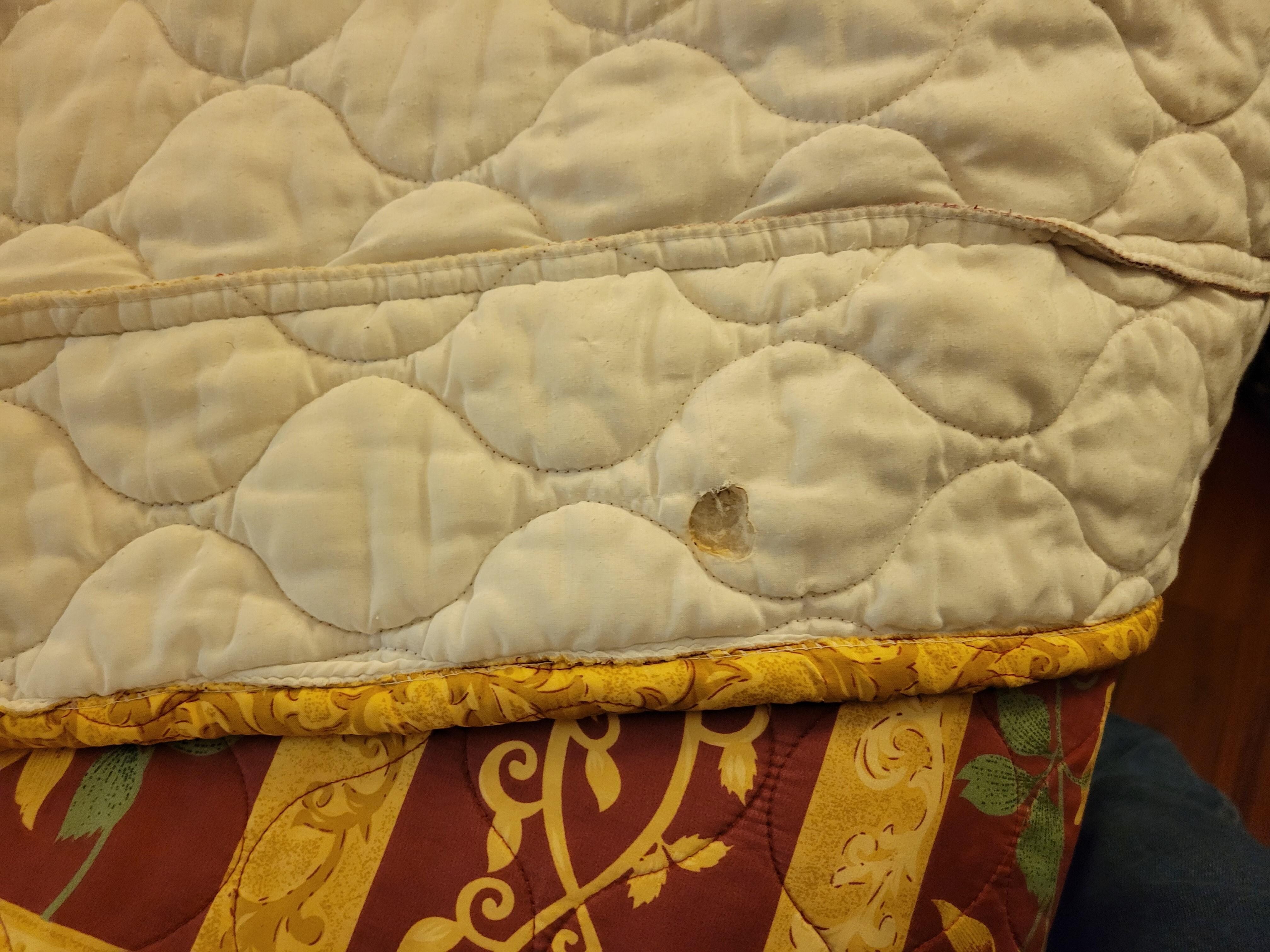 Another cigarette burn hole in back of bedspread.  Noticed at least 10 on the bed cover.