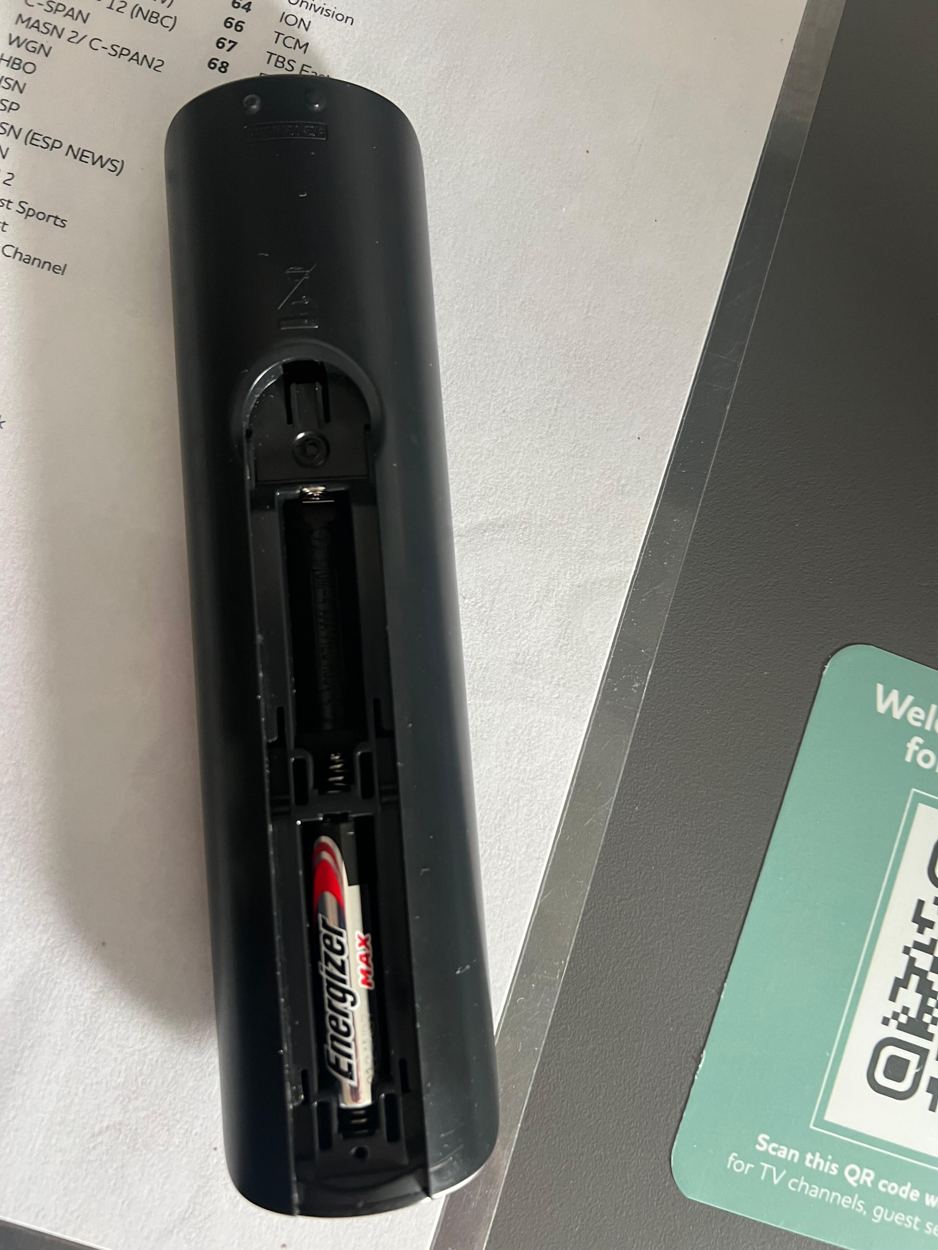 Remote with missing back cover.