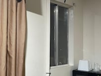 No window covering allowing view of the bed area by passersby