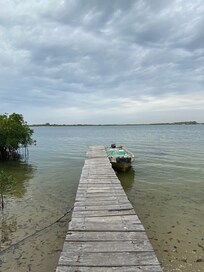 Dock at Bonobo Lodge with pirogue for return trip.