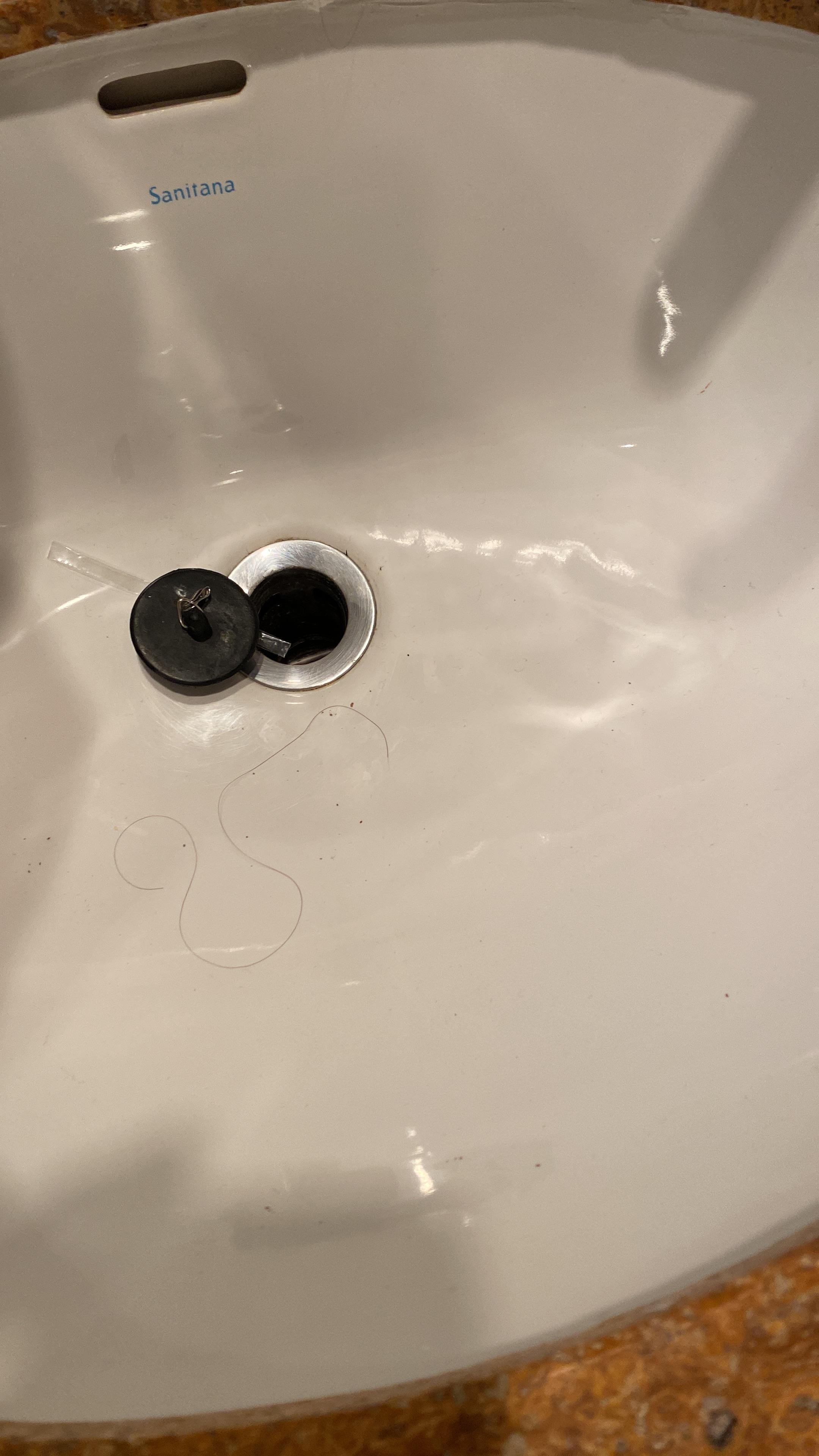 Broken sink cover which had tapped to cover up the broken piece