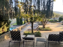 Courtyard next to the pool with lounge chairs.