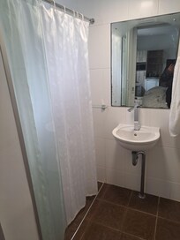Wet area, and toilet
