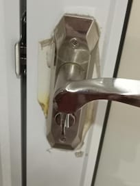 Bathroom door handle- old one removed but the dirt left behind is still there
