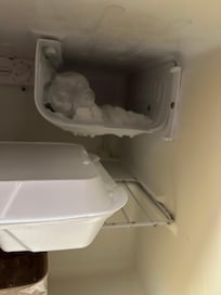 Ice build up the refrigerator, and obviously not a floor model.
