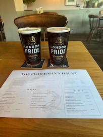 Food menu with two pints of Gales HSB.