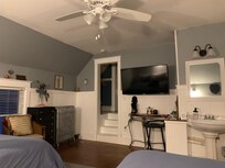 The two queen bed room is bigger than there photo makes it appear