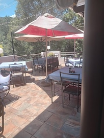 Al fresco dinning bar and beutifull restaurant food and service exceptional grills wings handout fries and my favorite milk tert