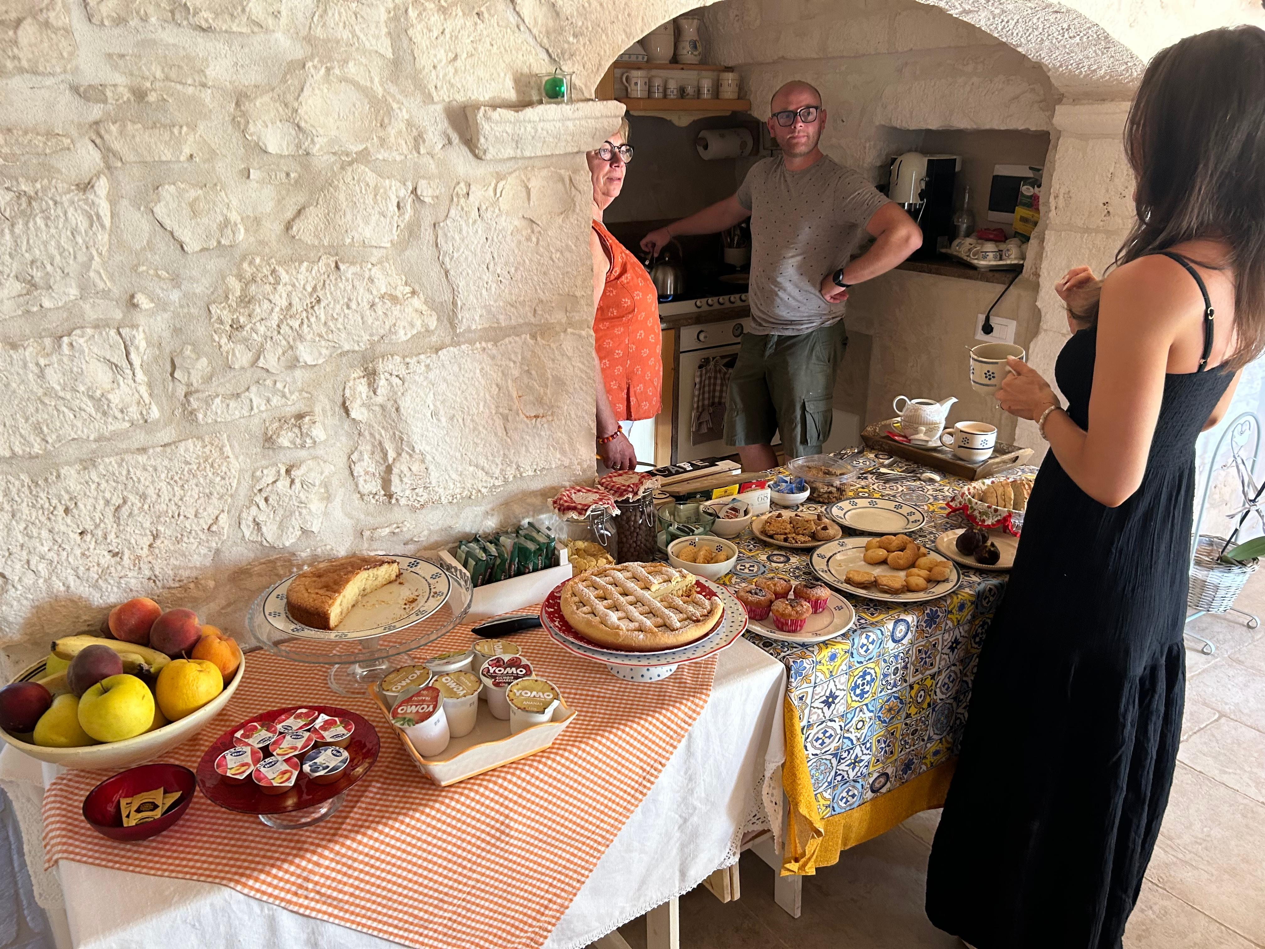 Here is a photo of me at their lovely breakfast and the Mother and son who run this place! 