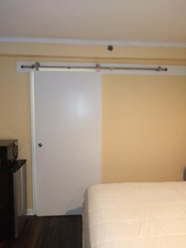 Sliding bathroom door give much more room at toilet!