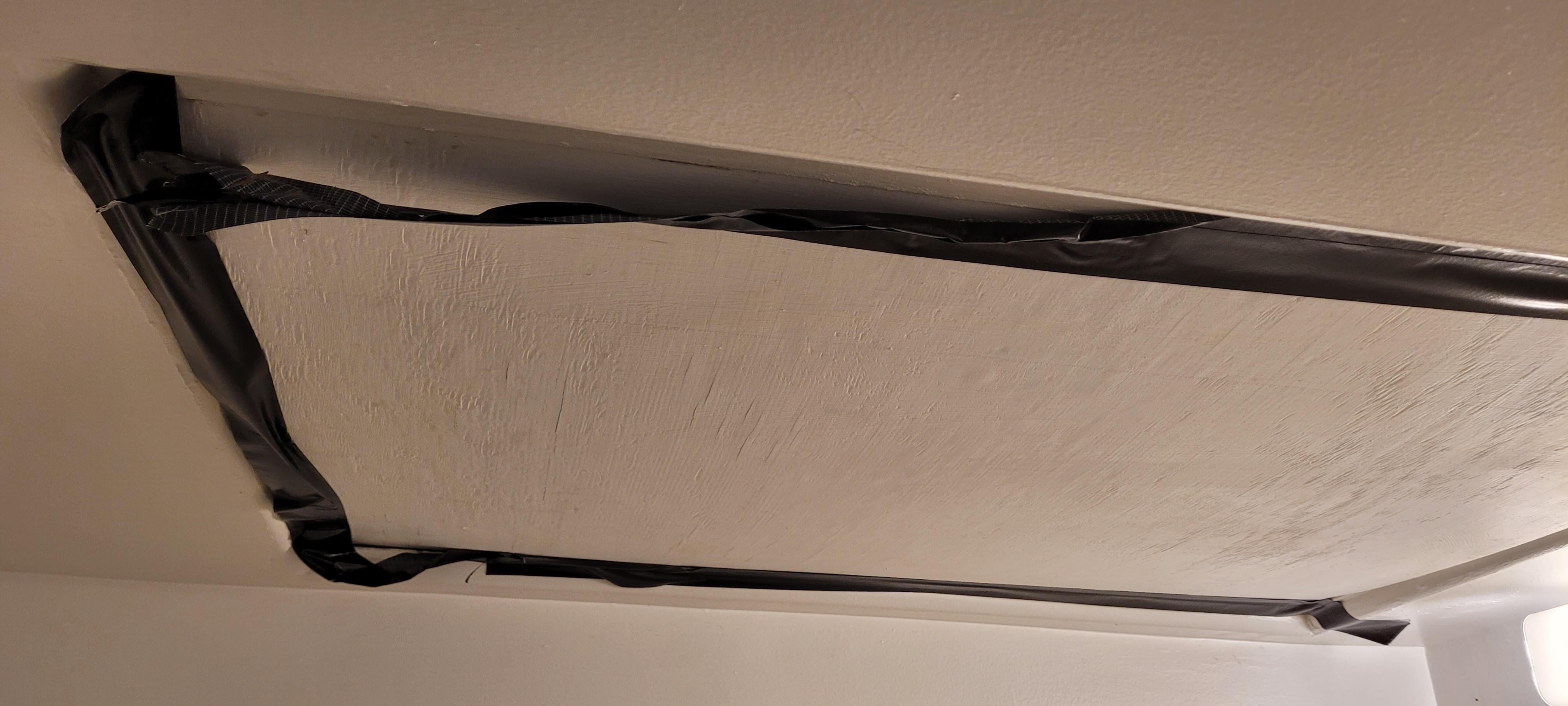 Ceiling in room, had tape on it to keep it closed or to insulate.