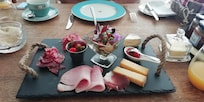 Breakfast platter - also delicious fruit salad, granola and yogurt then croissant, bread and selection of home made jams. Scrummy!