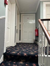 Sold as en-suite, shower was in room (tiny!) but toilet across the hall.