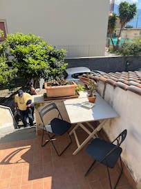 Bistro table by unit’s front door